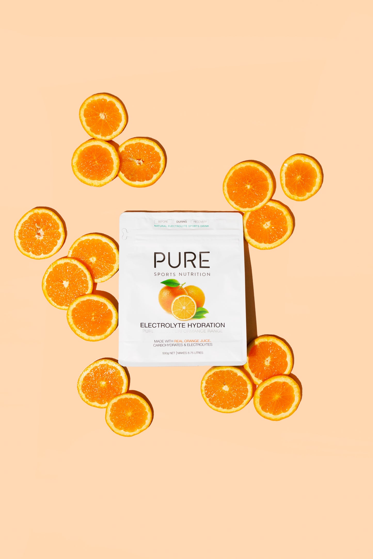 Product photo surrounded by oranges on light orange background