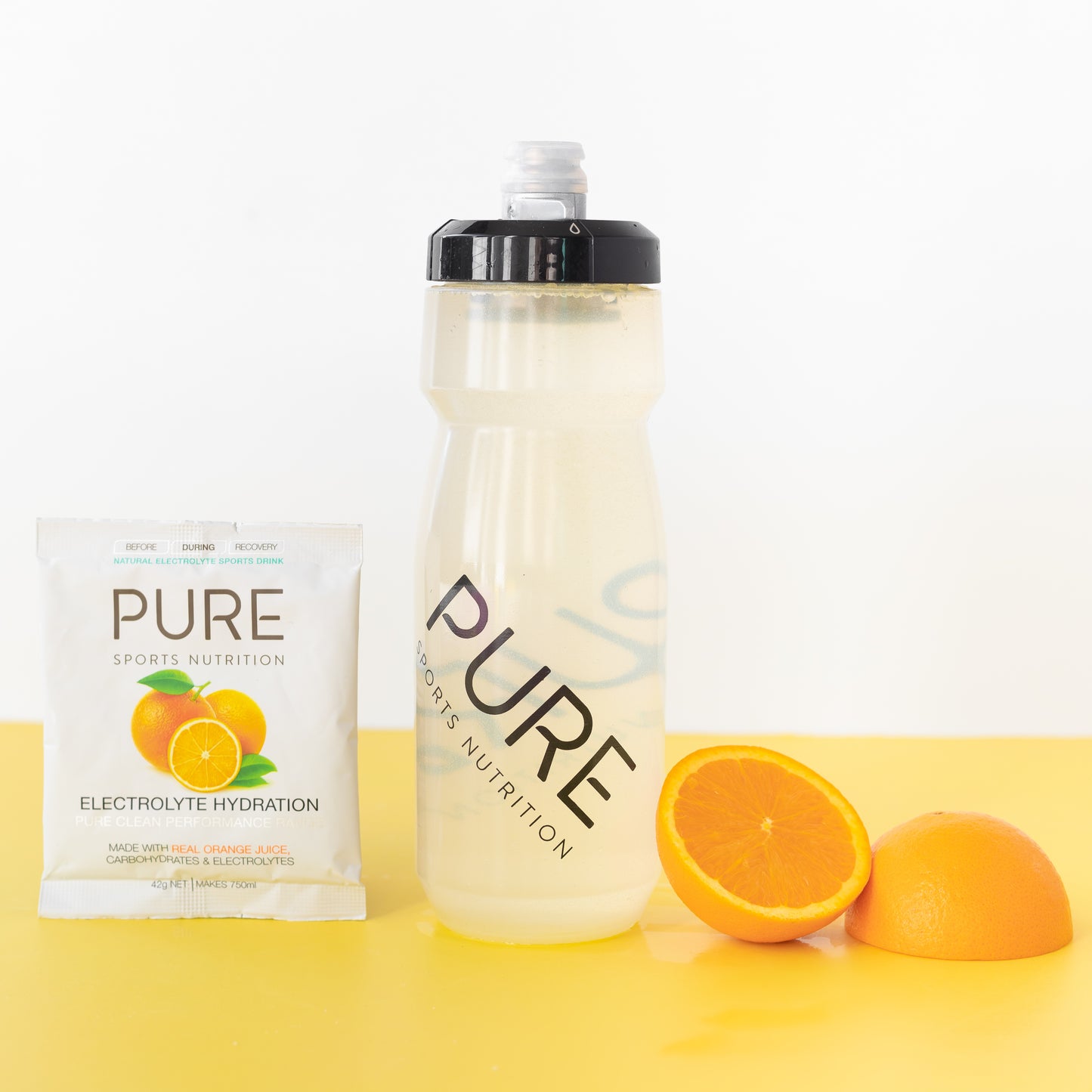 Product photo with oranges and water bottle in shot