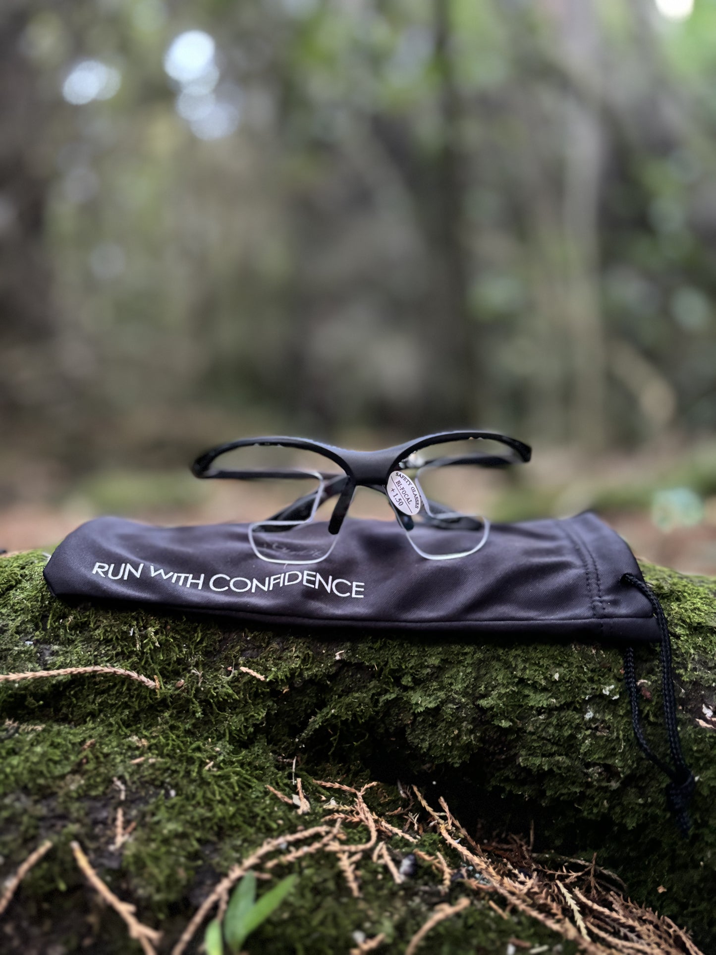 Product image of air optical glasses laying on case in forest