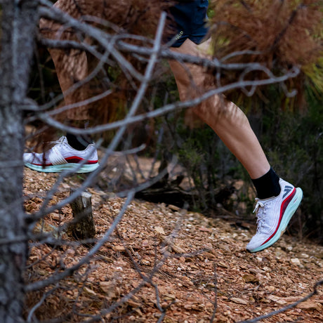 Runner wearing VJ Lightspeed trail shoes with amazing grip, lightweight for high performance on a rocky trail.