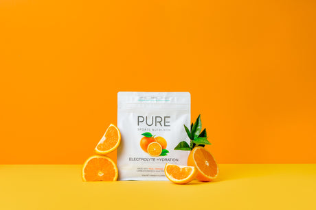 Product photo surrounded by oranges with orange background