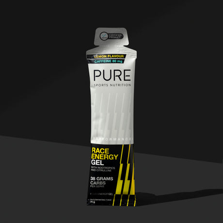 PURE Performance+ Race Energy Gel Lemon + Caffeine 70g sachet on a dark background